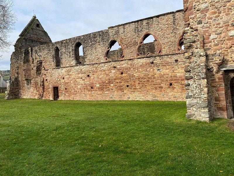 The roofless nave and window arches of Beauly Priory