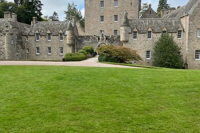 The towers and crow-stepped gables of Cawdor Castle above its lawn