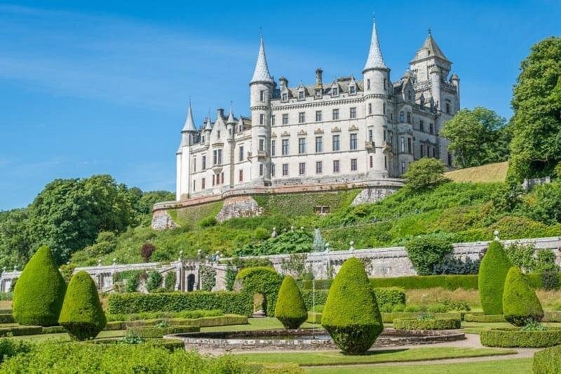The turrets and spires of Dunrobin Castle above its formal gardens