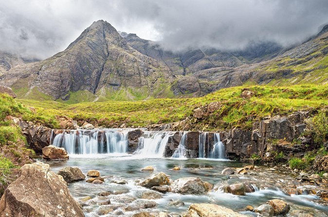 The Fairy Pools falling in steps below the Black Cuillin on Skye