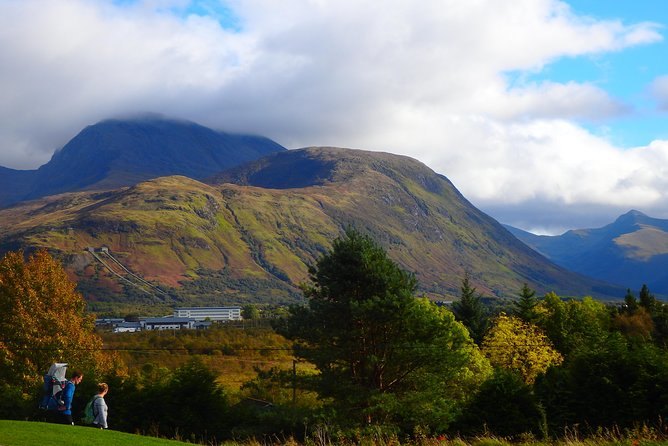 A broad Highland mountain rising above forest and water on the road west