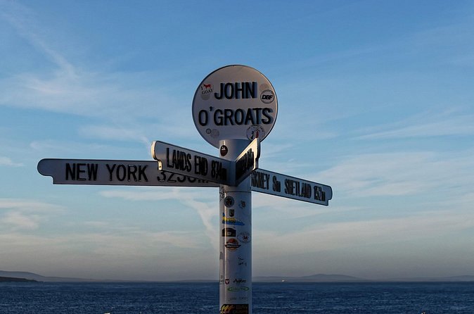 The signpost at John O'Groats pointing to Land's End and New York