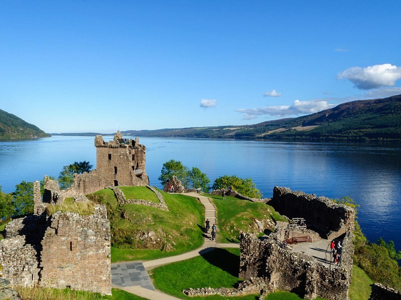 The ruins of Urquhart Castle on their headland, with Loch Ness stretching south